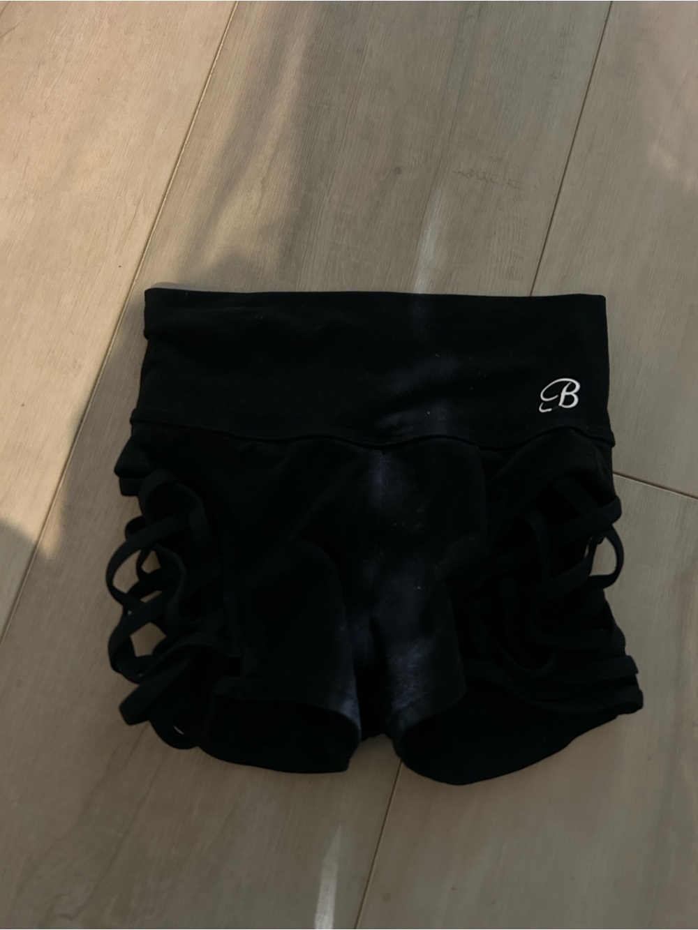 Bombshell Sportswear Black High-Waist Shorts with Side Strappy Cutouts